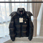 Long Moncler puffer jacket with hood, front zip, chest pocket and logo patch