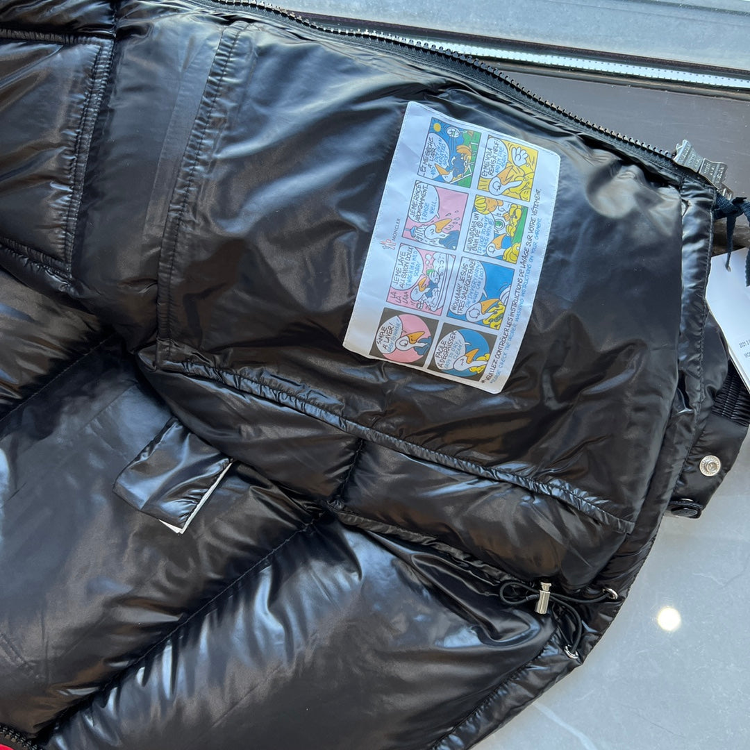 Long puffer jacket interior label patch visible near zipper opening