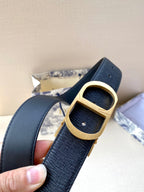 Dior belt close-up with dark blue strap and gold square buckle with prongs