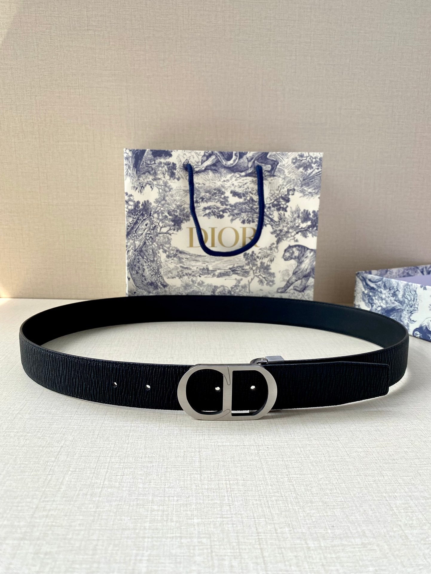 Dior belt flat with dark blue strap and black buckle with prong detail