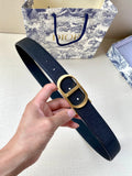Dior belt in dark blue textured fabric with gold buckle and prong detail