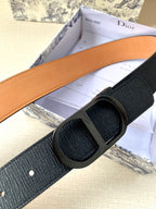 Dior belt close-up: dark navy strap, tan inner side, dark buckle