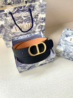 Dior belt dark navy strap with gold buckle, shown on box