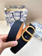 Dior belt with dark navy strap and gold buckle with round studs