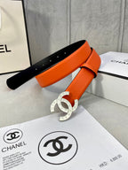 Orange leather belt with gold CC buckle and black inner strap