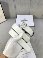Chanel belt in pale white leather with silver-toned CC buckle, coiled in box