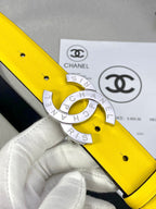 Yellow belt close-up with gold-tone CC buckle and black backing