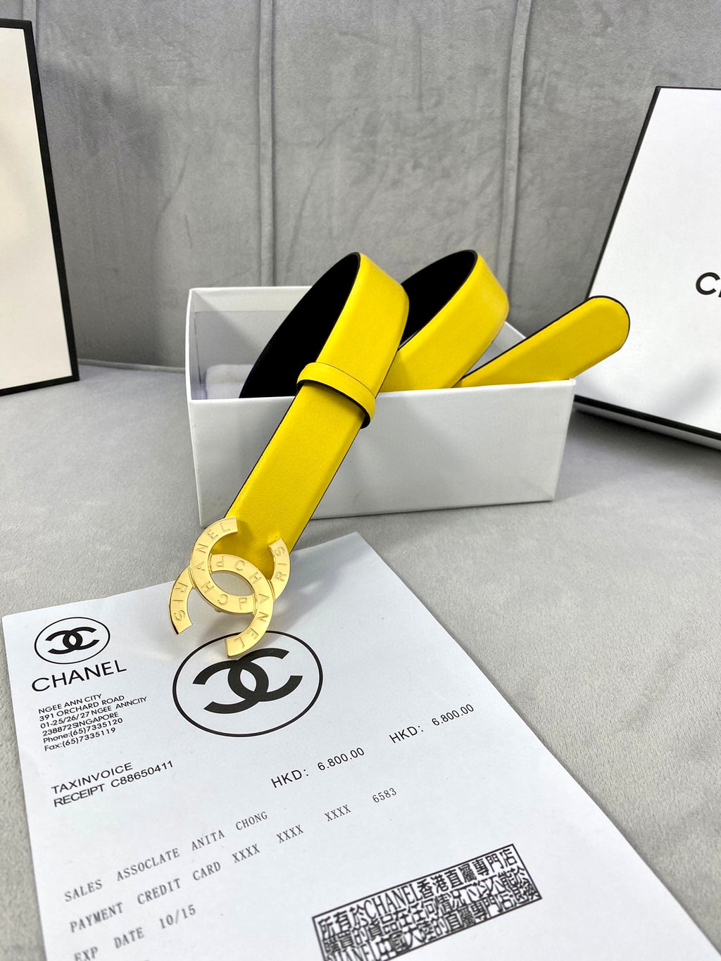 Yellow leather belt with gold-tone CC buckle and black inner strap