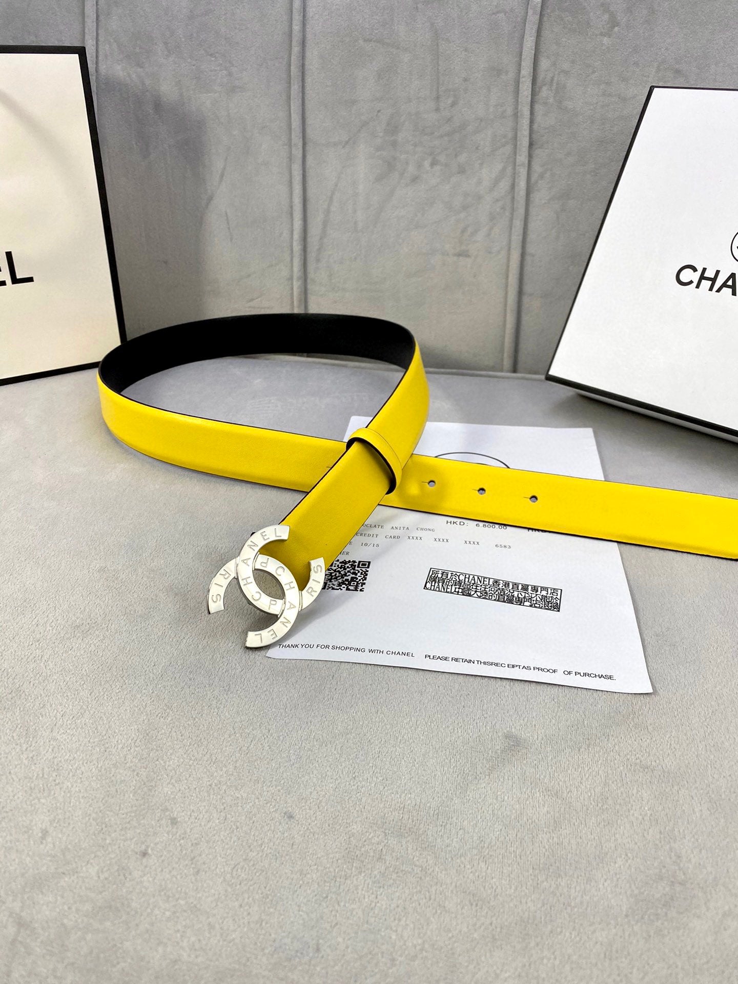 Yellow leather belt with gold-tone CC buckle and black interior strap