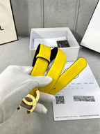 Yellow leather belt with gold-tone CC buckle in its box