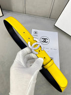 Yellow leather belt with gold-tone CC buckle and black back panel
