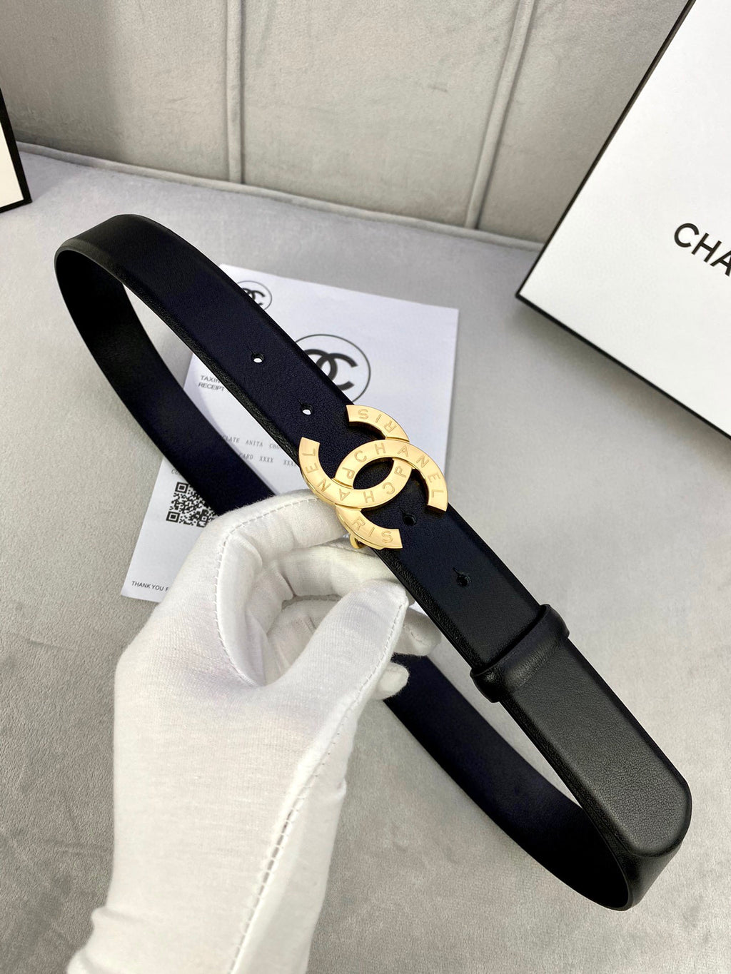 Dark navy leather belt with gold CC buckle