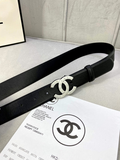 Black leather belt with silver CC buckle and adjustable strap tip