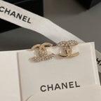 Gold-tone CC hoop and rhinestone earrings on card with CHANEL label