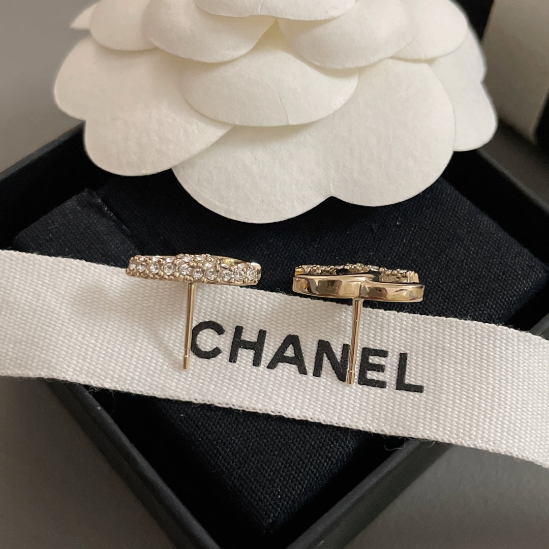 Gold-tone bar stud earrings with crystal tops, on CHANEL ribbon
