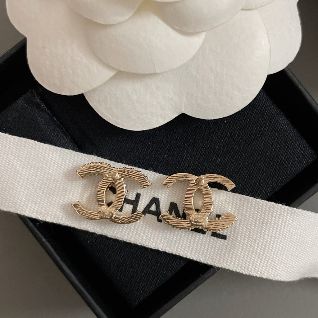 Gold-tone CC hoop earrings with rhinestone accents, on CHANEL ribbon