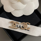 Gold-tone CC hoop earrings with rhinestone accents, on CHANEL ribbon