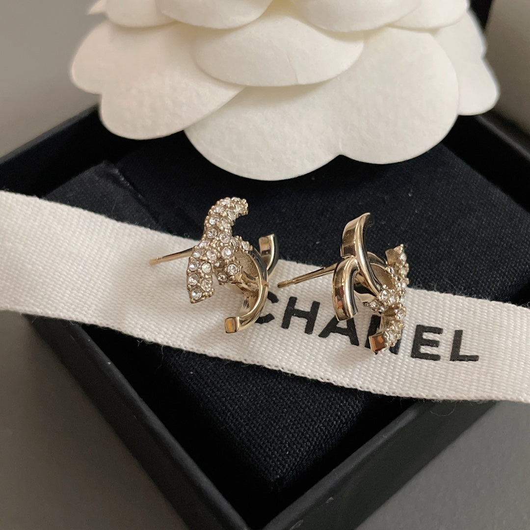 Gold-tone CC hoop earrings with rhinestone clusters, on CHANEL ribbon