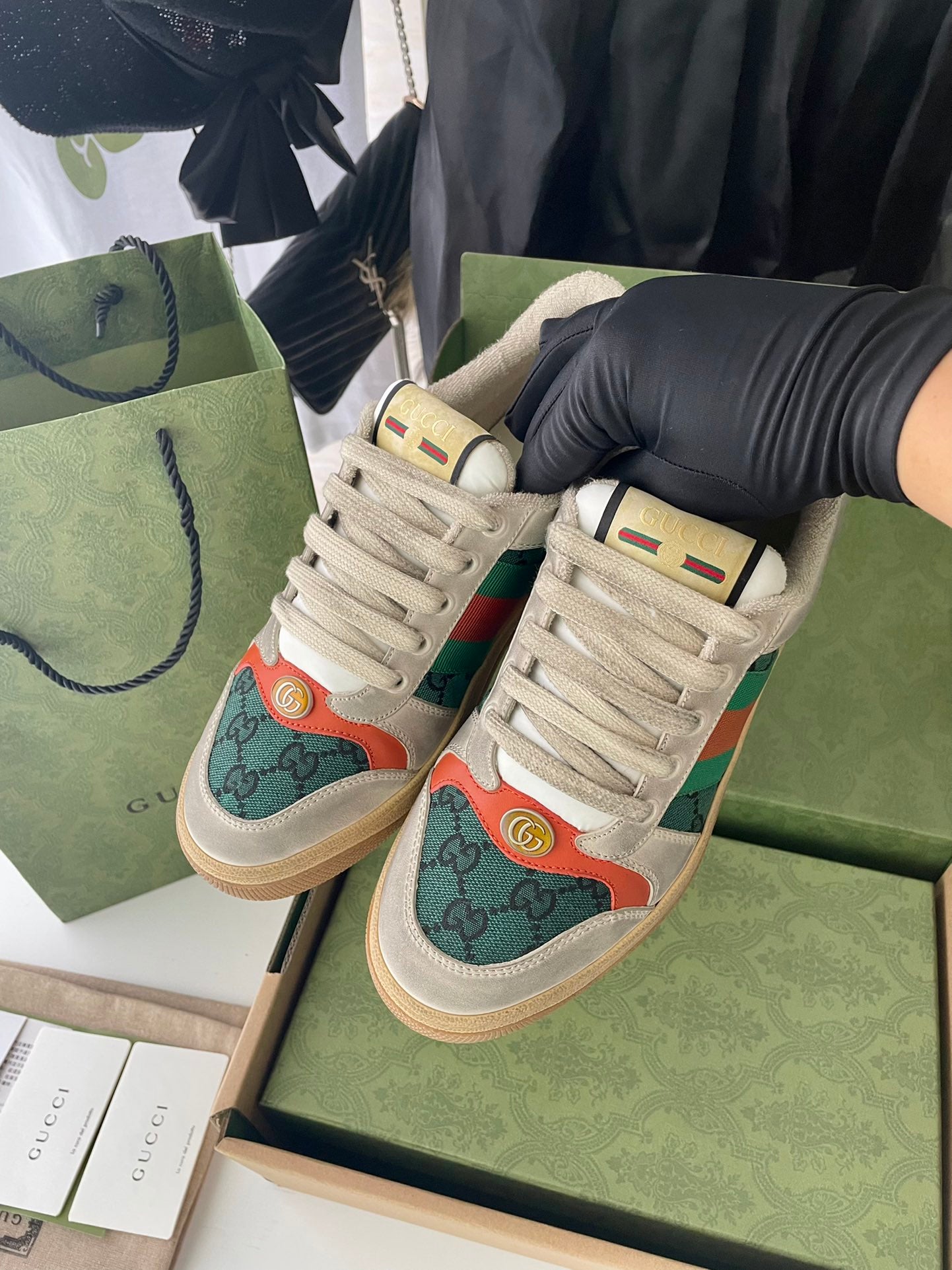Pair of Gucci unisex sneakers in light beige with green and orange logo panels