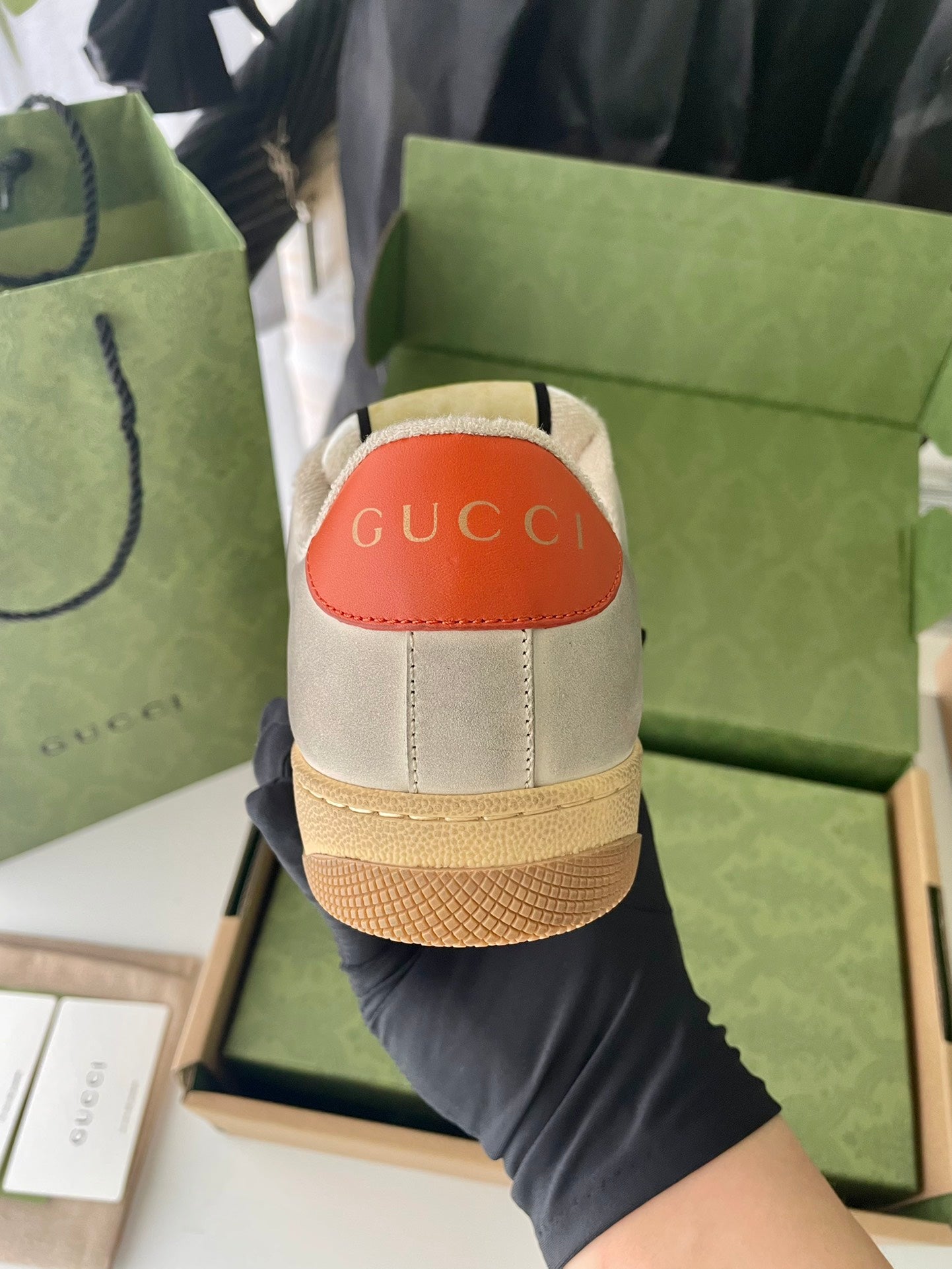 Gucci unisex sneakers with light beige back panel and orange heel label