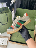 Gucci unisex sneakers in light beige with green and orange logo panel