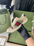 Gucci sneaker with beige GG canvas and red/green Web stripe, lace-up.