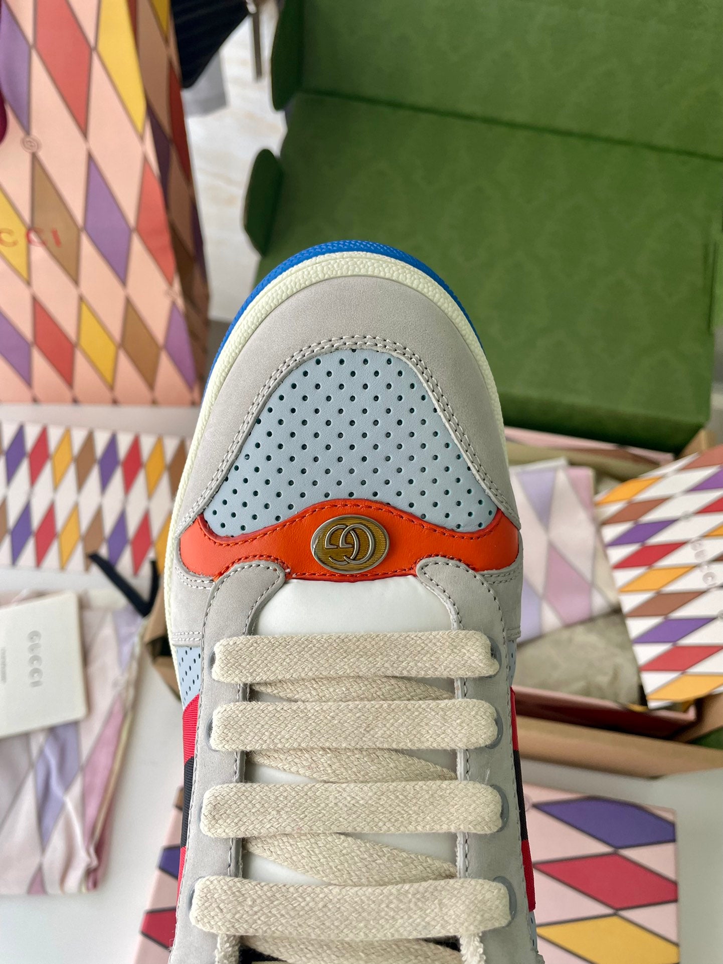 Gucci unisex sneakers toe and laces front, perforated light gray panels with orange accent