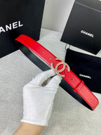Red leather belt with gold-tone CC logo buckle, showing the length and holes
