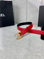 Red leather belt with gold-tone CC logo buckle, angled view of the front