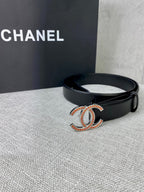 Black leather belt with jeweled CC logo buckle, with one strap end