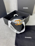 Light gray belt with oval CC buckle in gift box with black tissue paper