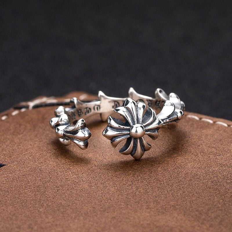 Floral charm bracelet with silver-tone open circle design and flower details