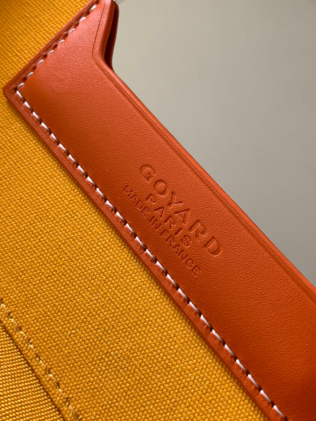 Goyard bag leather edge trim detail in tan with stitched edging and embossed text
