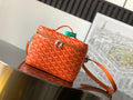 Goyard bag in orange with signature monogram, top zip, and crossbody strap