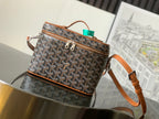 Goyard patterned canvas crossbody bag with brown leather trim and zipper, top handle