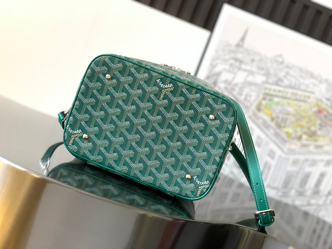 Goyard teal small bag with front zip, rounded top handle and leather side tabs