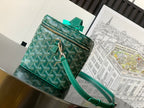 Goyard bag with teal crossbody strap, front zip pocket and teal leather trim