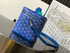 Blue small crossbody bag with bow detail, zip closure, and blue shoulder strap