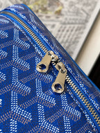 Blue patterned zipper close-up with silver pull tabs and rings
