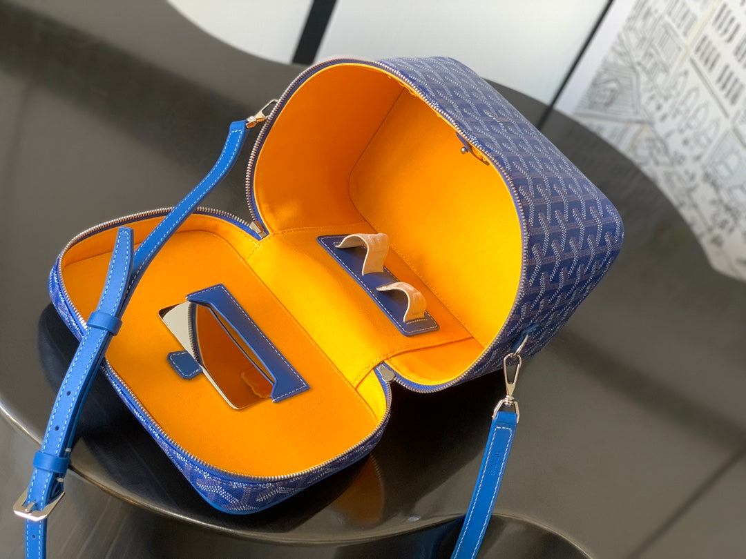 Blue patterned mini bag with orange interior lining and top opening