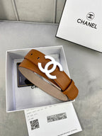 Chanel belt detail, tan leather strap with gold-tone CC logo buckle and punch holes