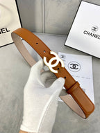 Chanel belt held up, tan leather with gold-tone CC logo buckle and strap holes