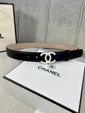 Black leather belt with gold CC buckle, laid flat on its box