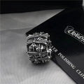 Chrome square ring with ornate crosswork