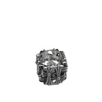 Chrome ornate ring with raised floral cross and diamond-like center