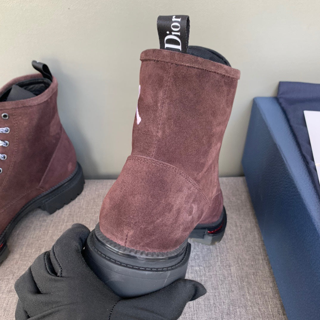 Unisex dark brown suede boots with Dior label on collar and treaded rubber sole