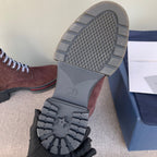 Boot outsoles and heel tread in gray with embossed pattern