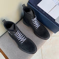 Black suede lace-up ankle boots with padded collar, contrast red sole trim