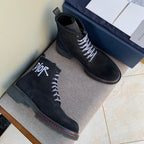 Black suede Dior lace-up ankle boots, chunky sole and red edge stitching