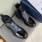 Black unisex leather ankle boots with lace-up closure and Dior logo on the tongue